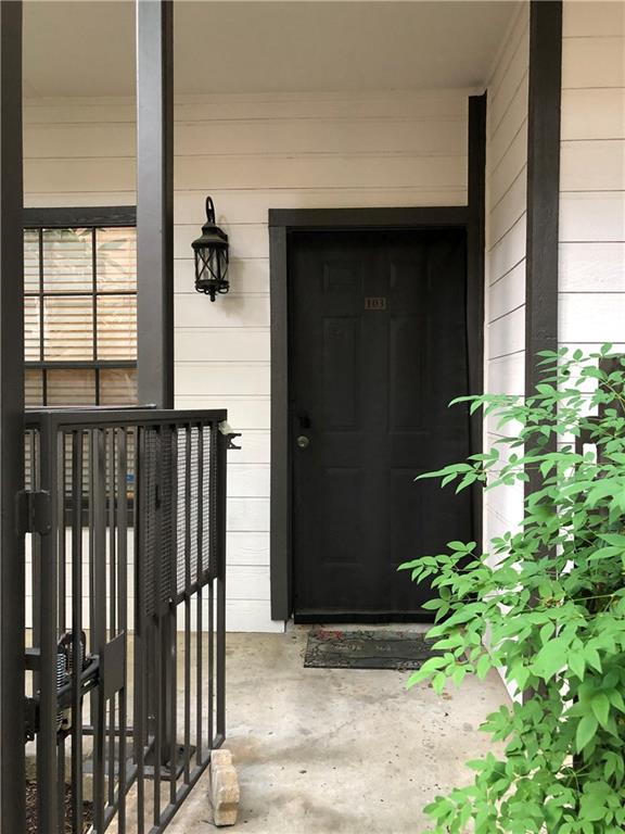 203 East 31st Street, Unit 103 Austin, TX 78705 - Photo 4 of 32 a front view of a house having yard