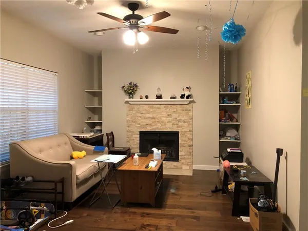 a living room with furniture and a fireplace