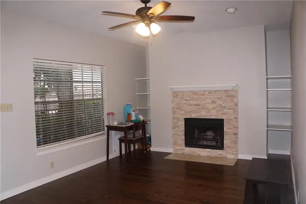a view of a livingroom with furniture and wooden floor