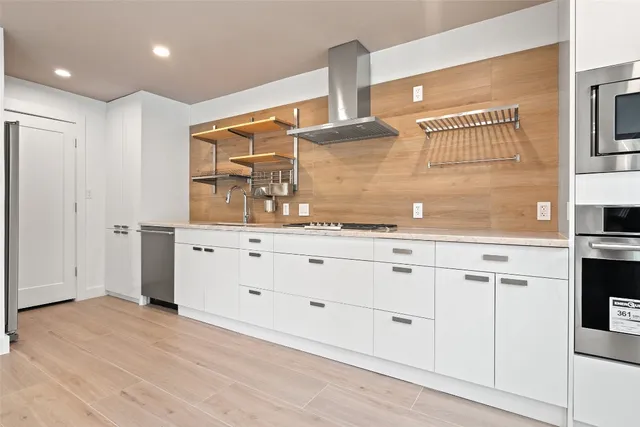 a bathroom with a sink a mirror and a vanity