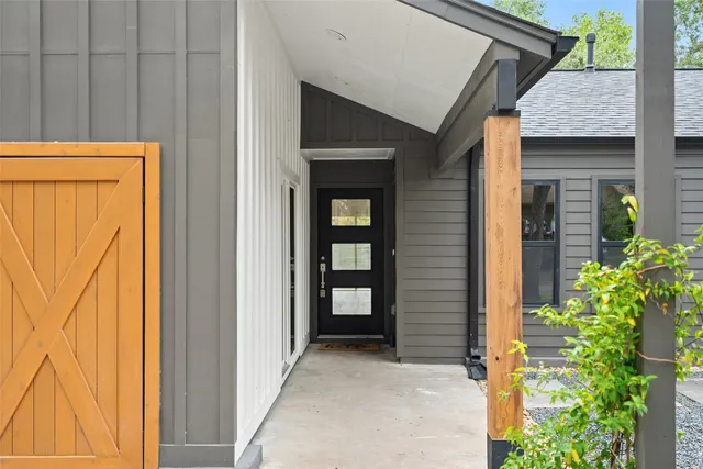a view of front door of house and stairs
