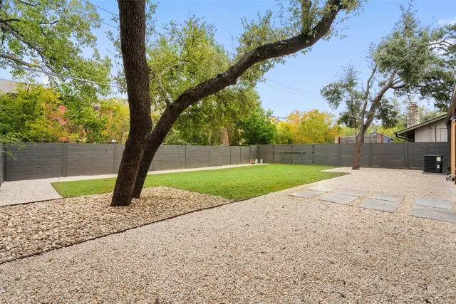 a view of backyard with green space