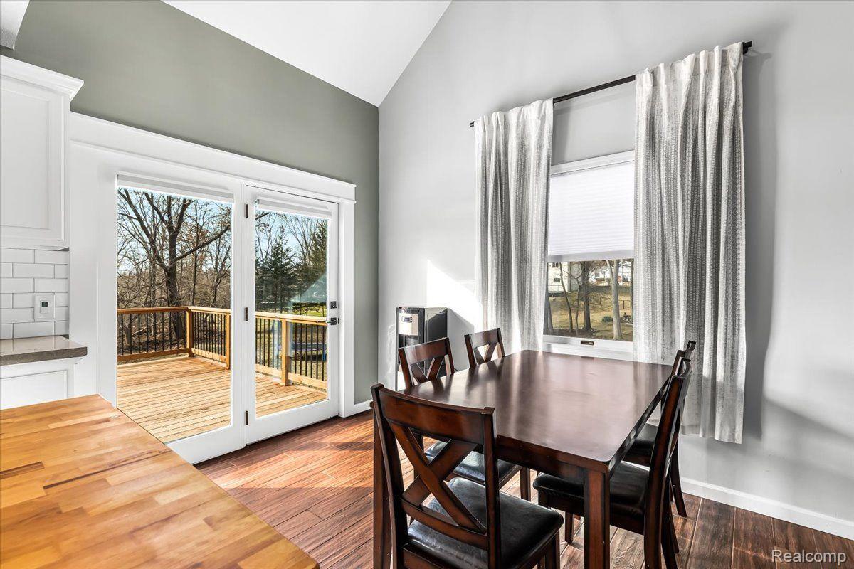 547 Glenwyth Road Brighton, MI 48116 - Photo 10 of 42 Sliding glass doors with a view of the pond.