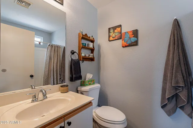 a kitchen with stainless steel appliances granite countertop a sink a stove a microwave and cabinets