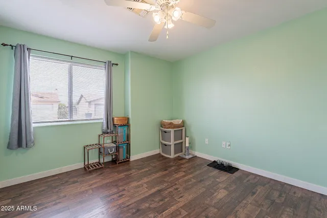 a bathroom with a sink vanity mirror and toilet