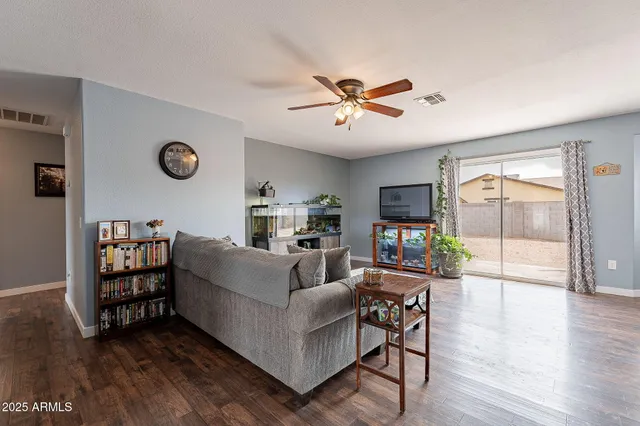 a kitchen with granite countertop a sink stainless steel appliances and cabinets