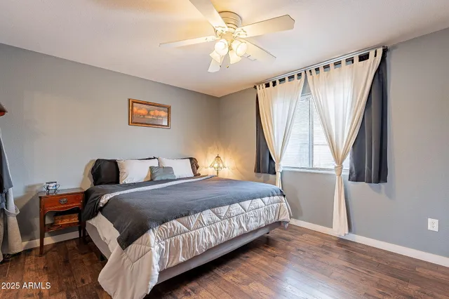 a kitchen with granite countertop a sink a stove and cabinets