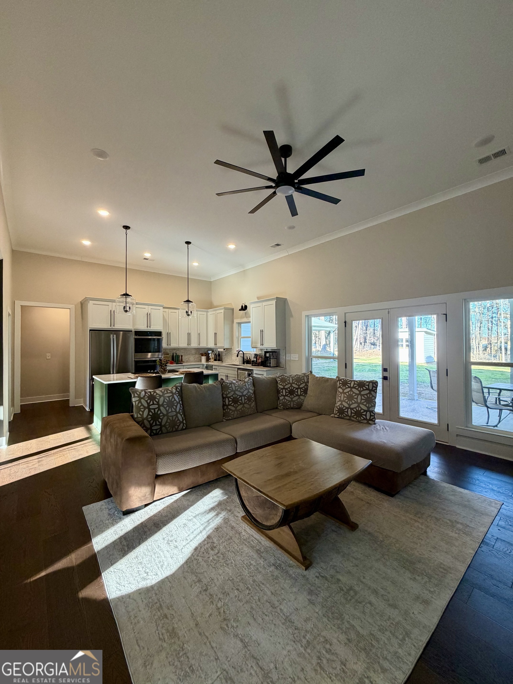 3050 Mahlon Smith Road Social Circle, GA 30025 - Photo 15 of 37 a living room with furniture and a chandelier