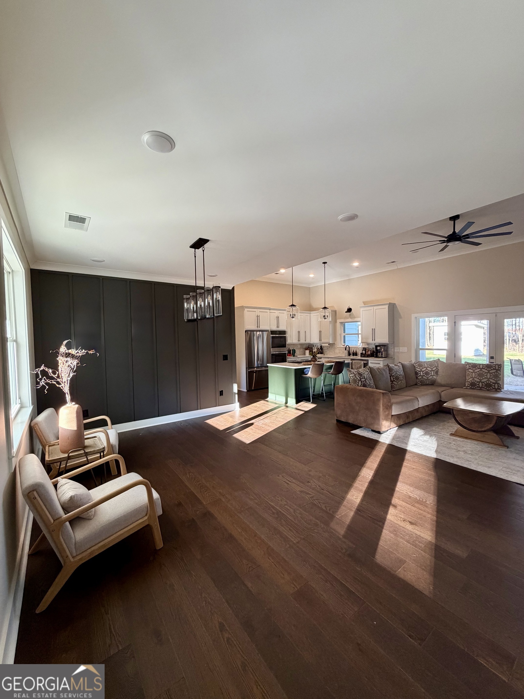 3050 Mahlon Smith Road Social Circle, GA 30025 - Photo 17 of 37 a living room with furniture and a chandelier
