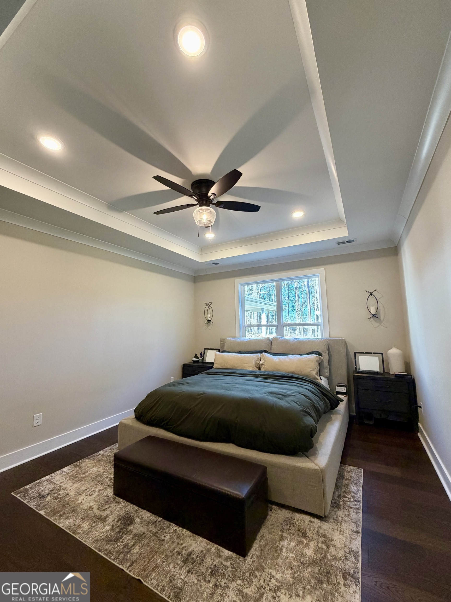 3050 Mahlon Smith Road Social Circle, GA 30025 - Photo 18 of 37 a bedroom with a bed and wooden floor