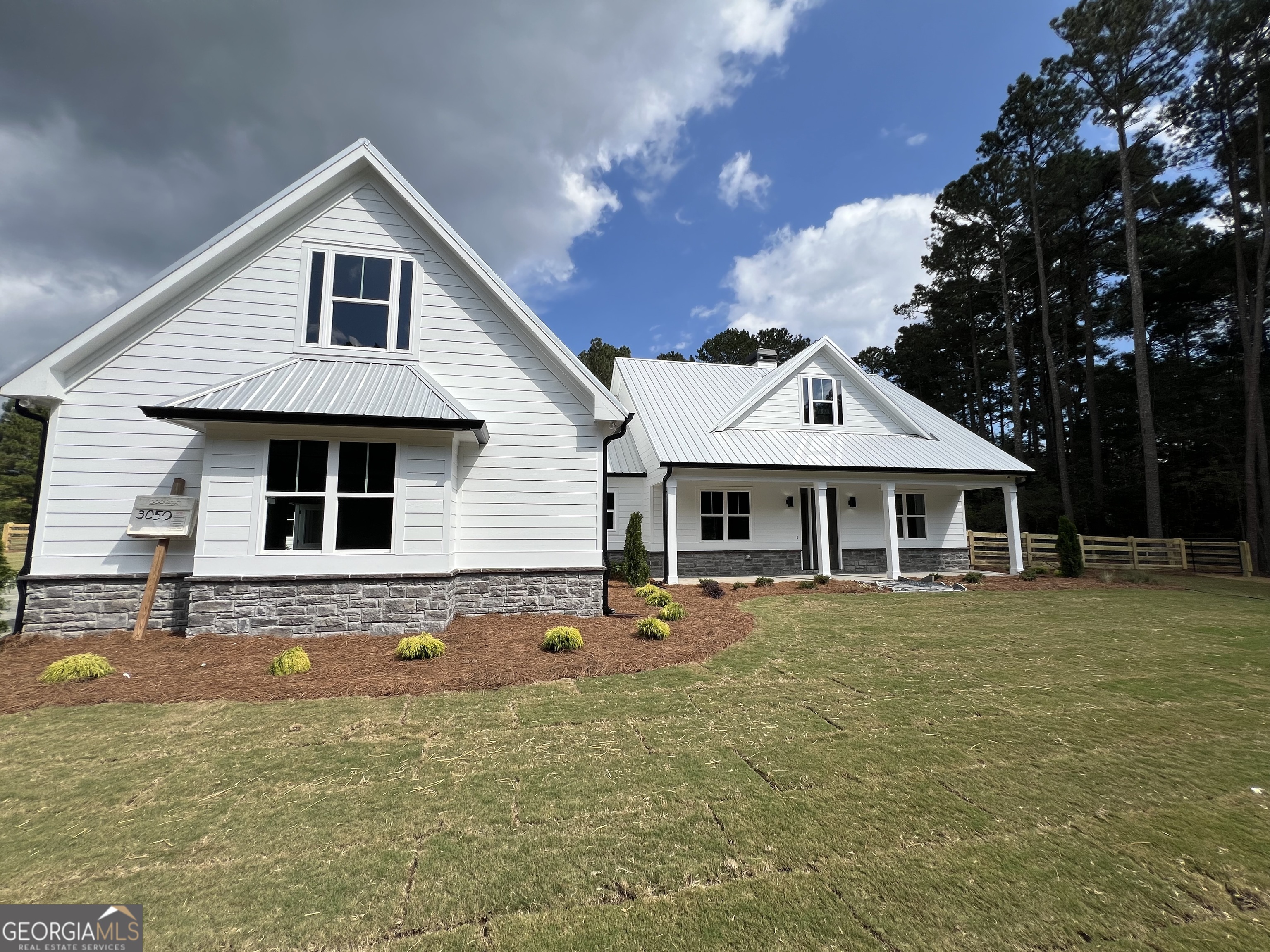 3050 Mahlon Smith Road Social Circle, GA 30025 - Photo 2 of 37 a front view of a house with a yard