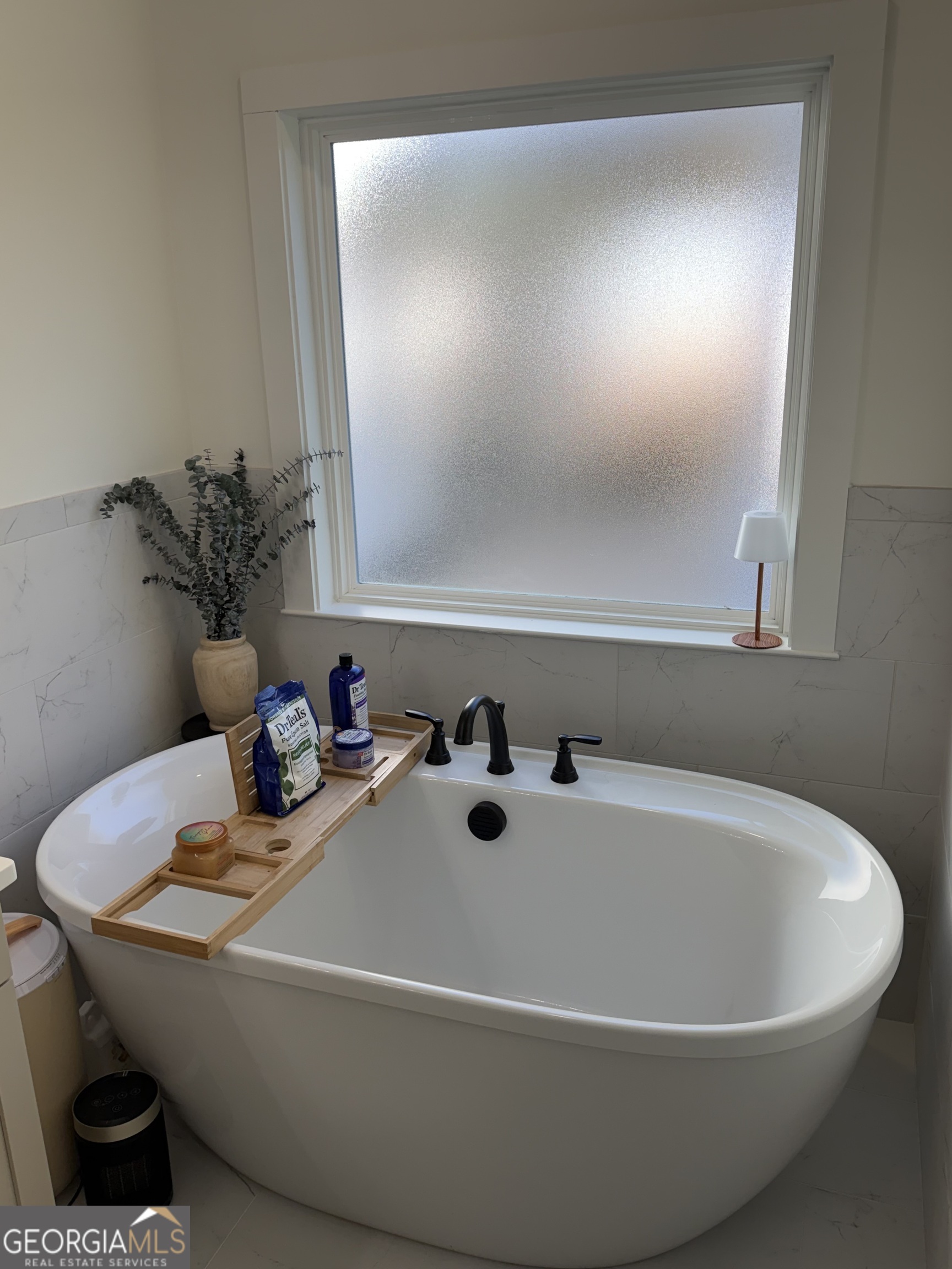 3050 Mahlon Smith Road Social Circle, GA 30025 - Photo 23 of 37 a white bath tub sitting in a bathroom