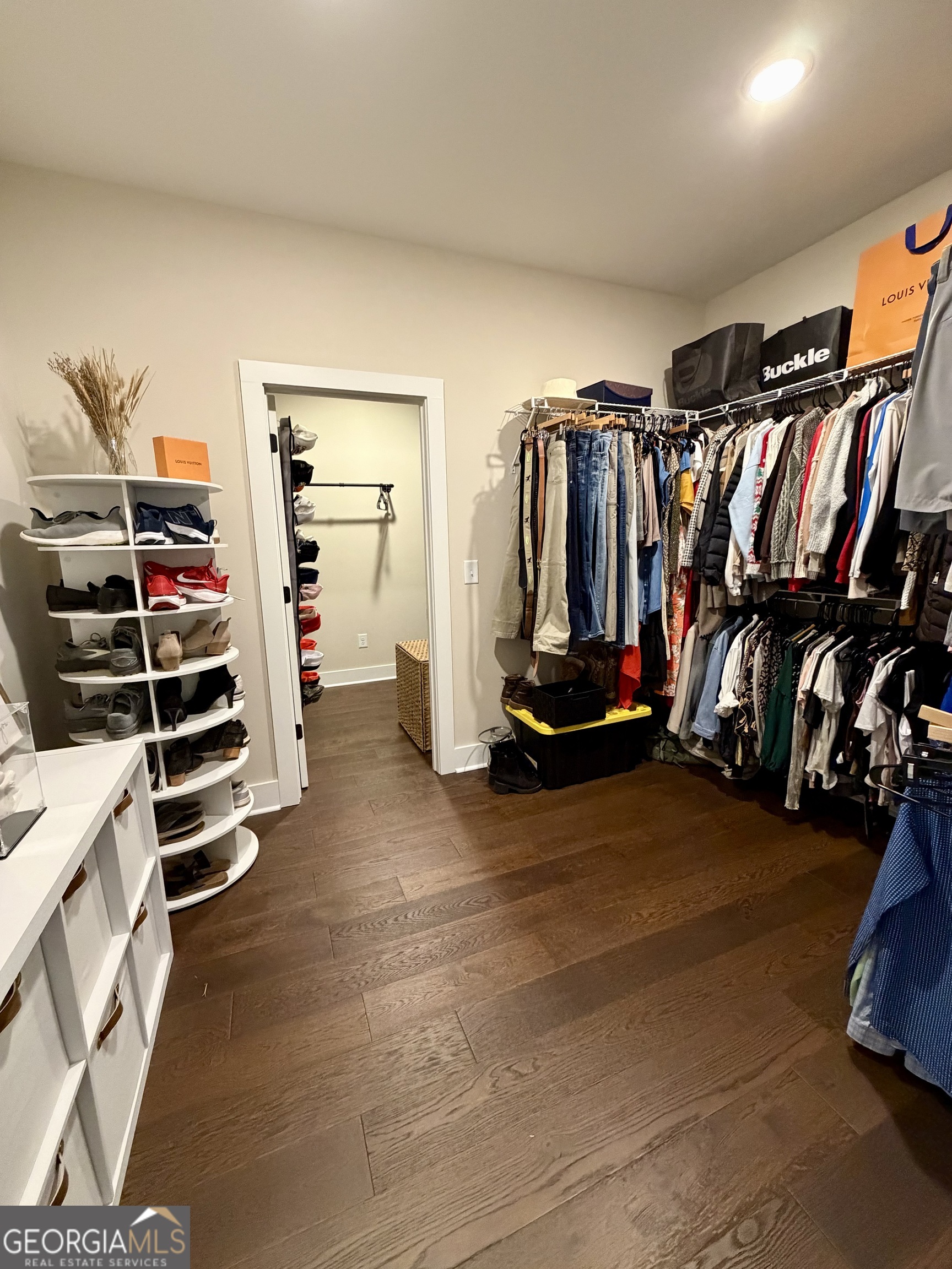 3050 Mahlon Smith Road Social Circle, GA 30025 - Photo 24 of 37 a view of walk in closet with clothes and shoes