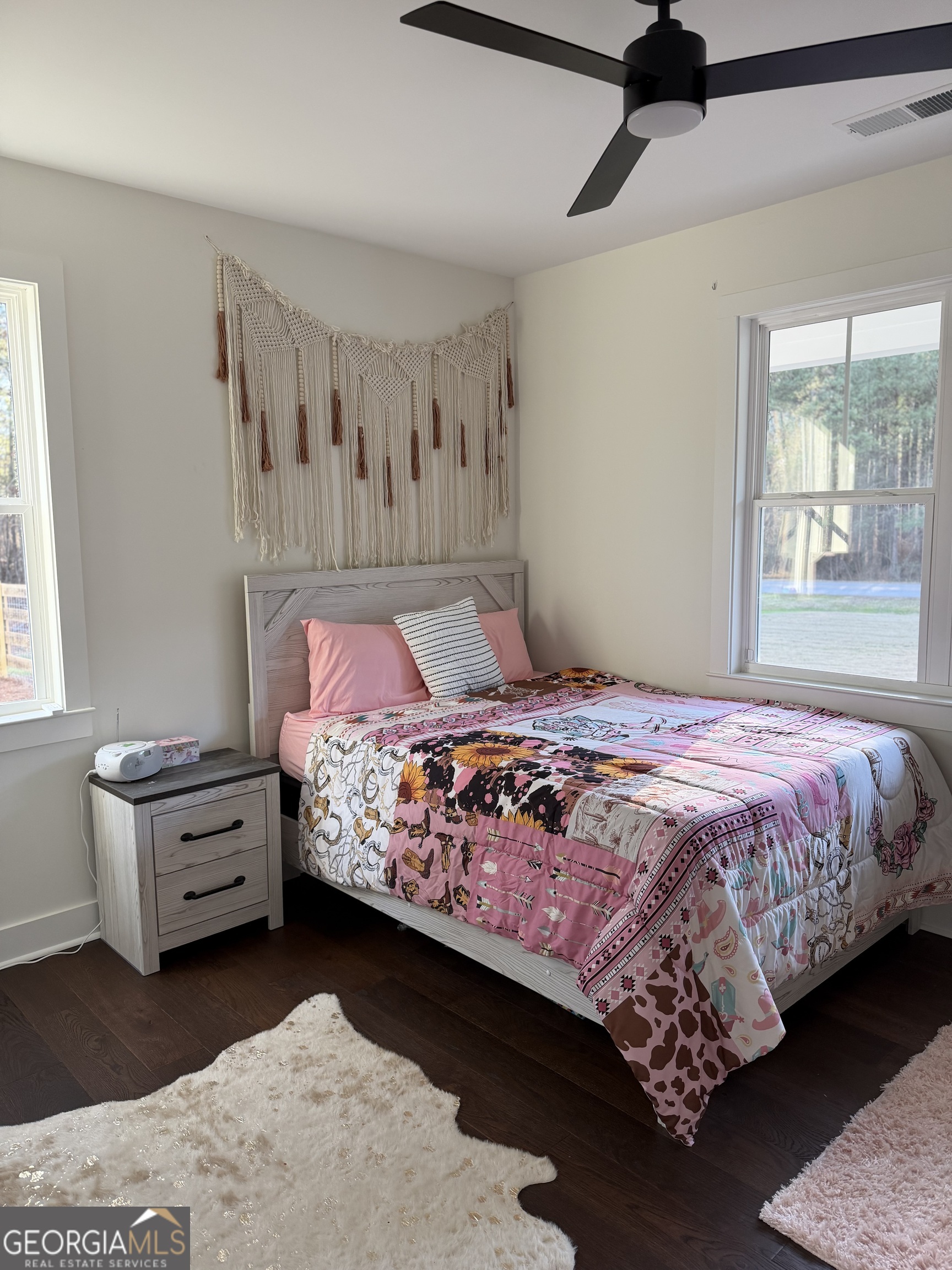 3050 Mahlon Smith Road Social Circle, GA 30025 - Photo 29 of 37 a bedroom with a bed and window