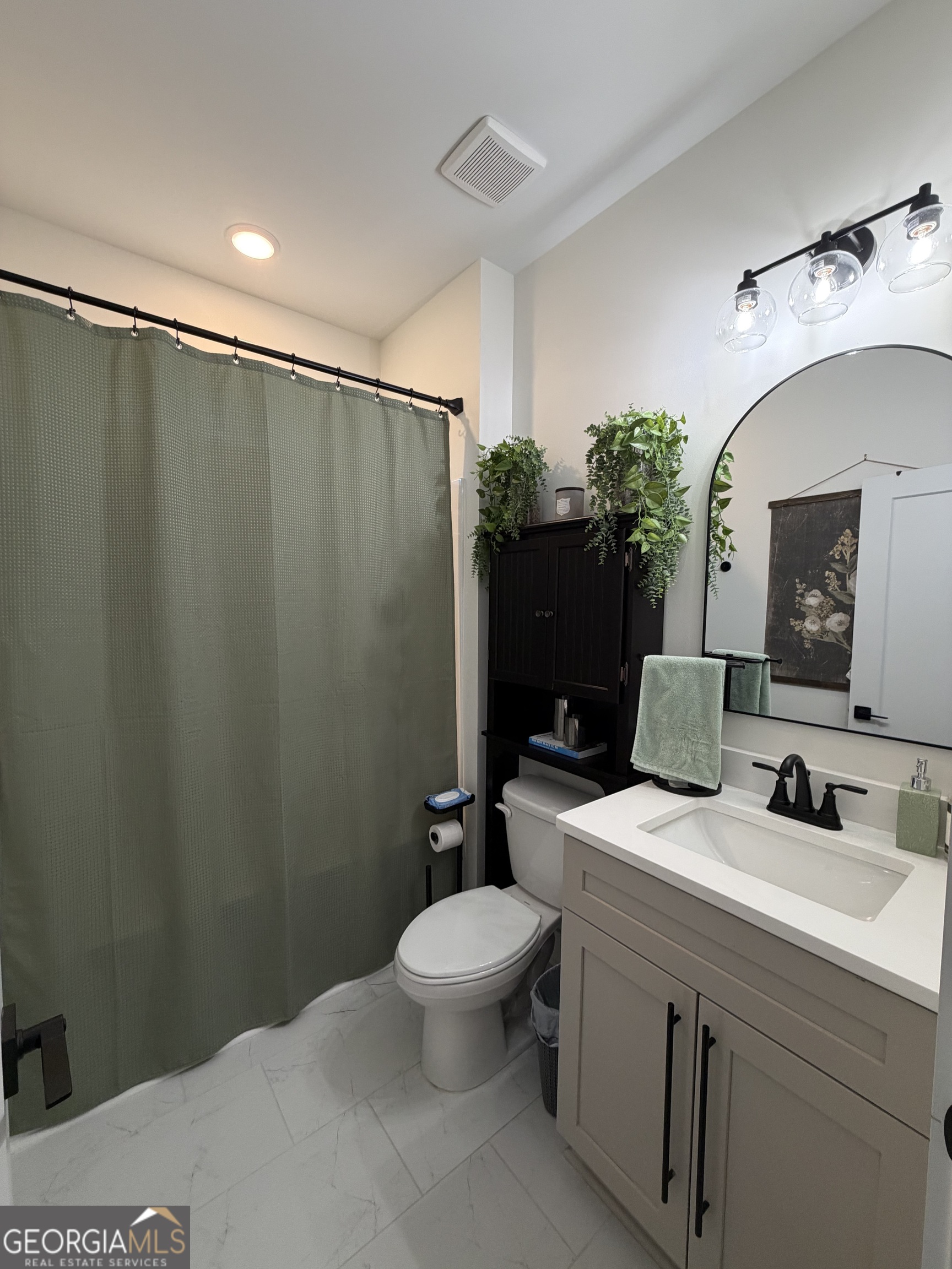 3050 Mahlon Smith Road Social Circle, GA 30025 - Photo 31 of 37 a bathroom with a sink toilet and shower