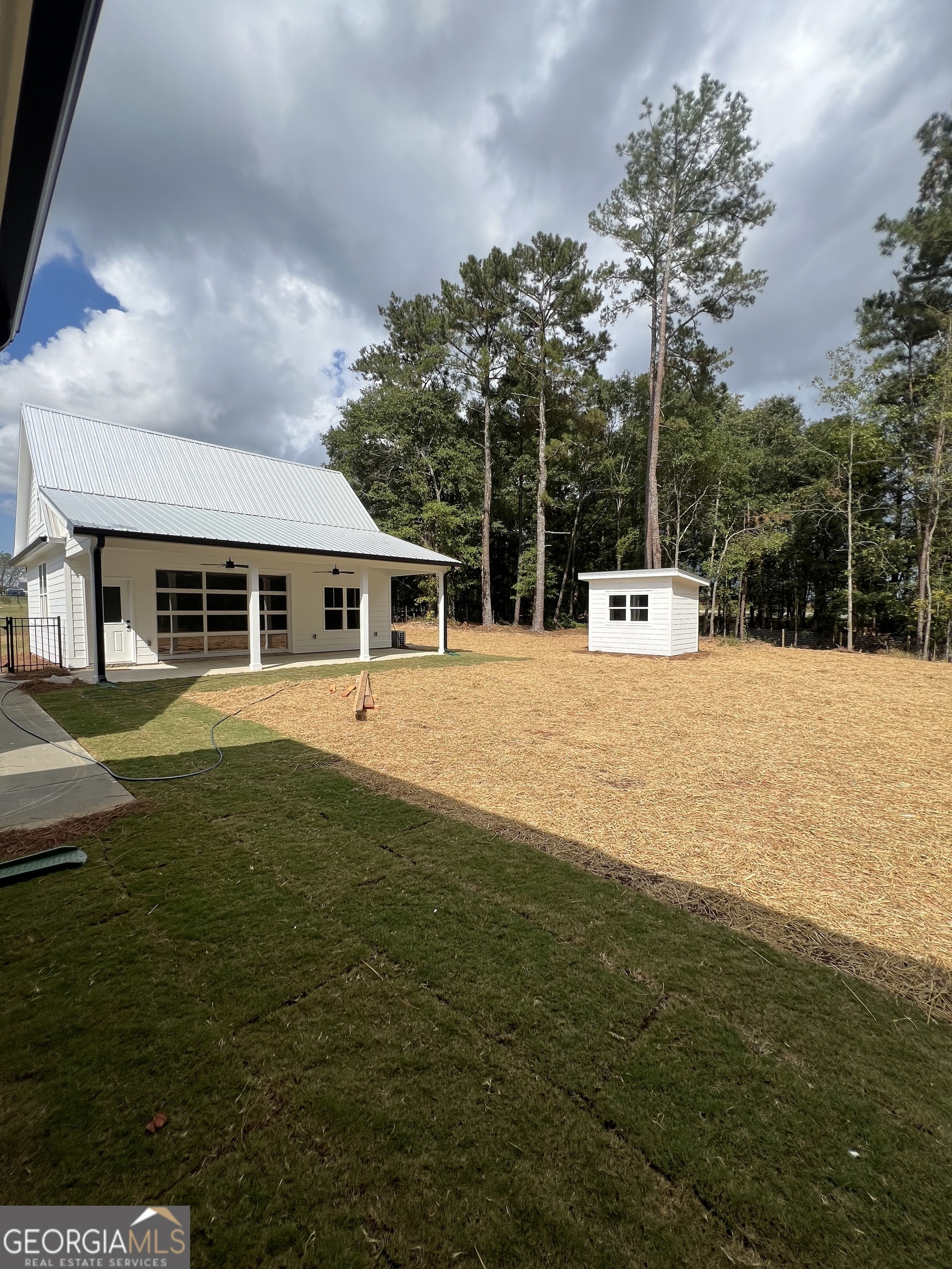 3050 Mahlon Smith Road Social Circle, GA 30025 - Photo 34 of 37 a view of a house with pool and a yard
