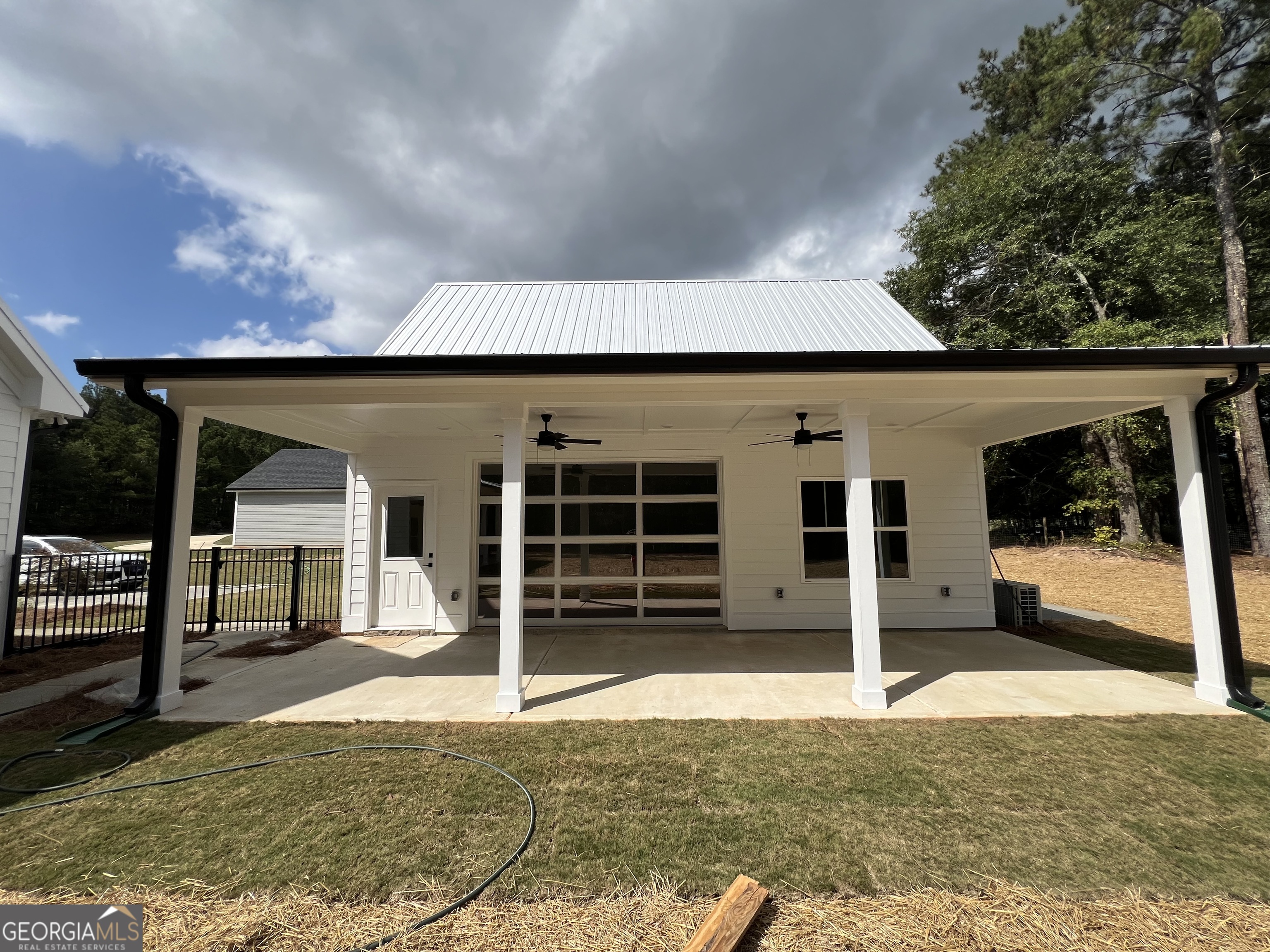 3050 Mahlon Smith Road Social Circle, GA 30025 - Photo 35 of 37 a front view of a house with a yard