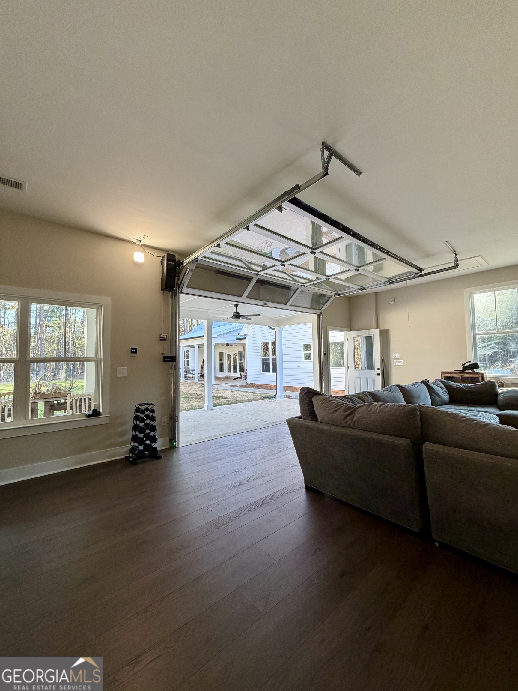 3050 Mahlon Smith Road Social Circle, GA 30025 - Photo 36 of 37 a living room with furniture and a window
