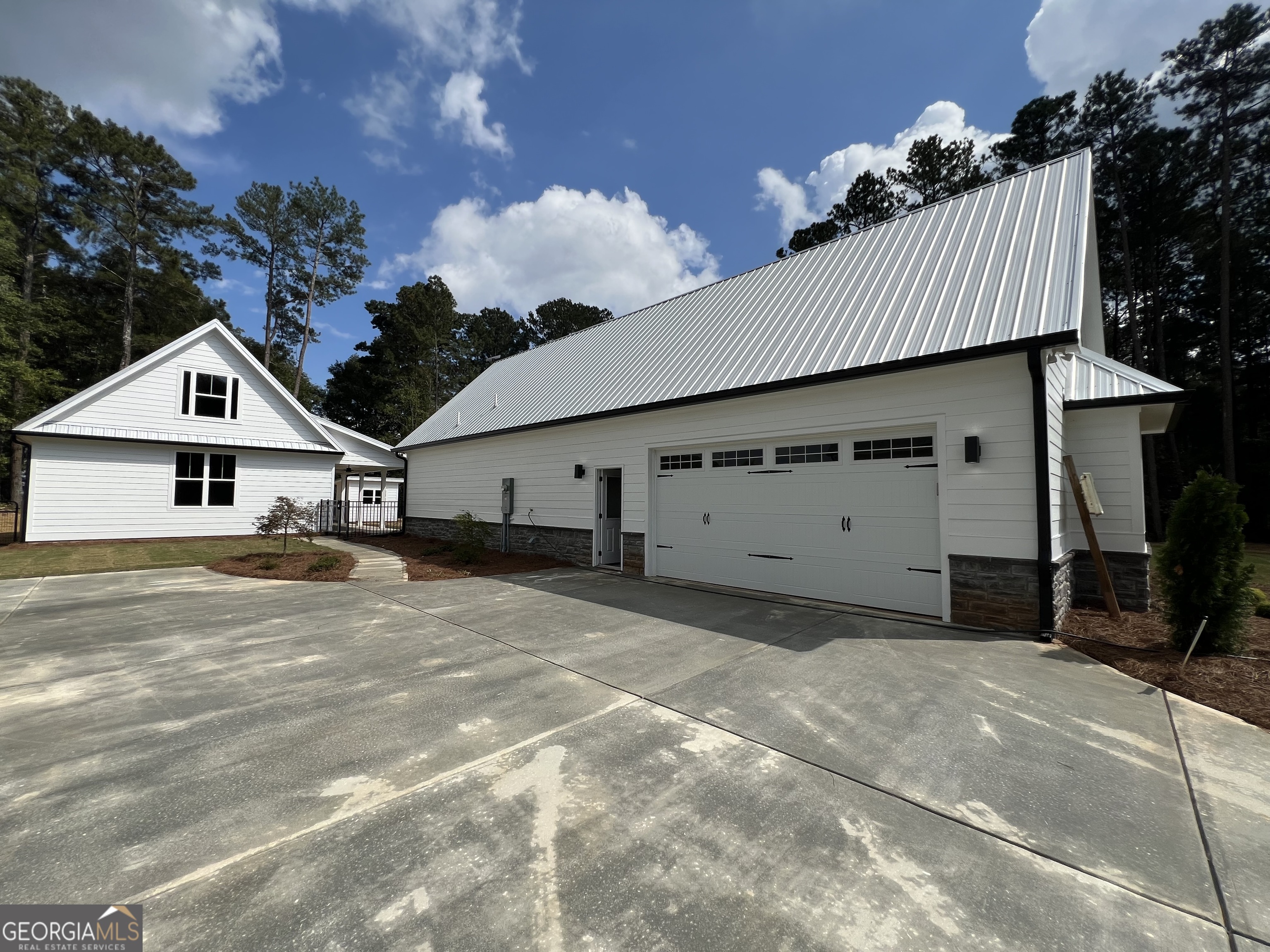 3050 Mahlon Smith Road Social Circle, GA 30025 - Photo 5 of 37 a view of a house with a yard and garage