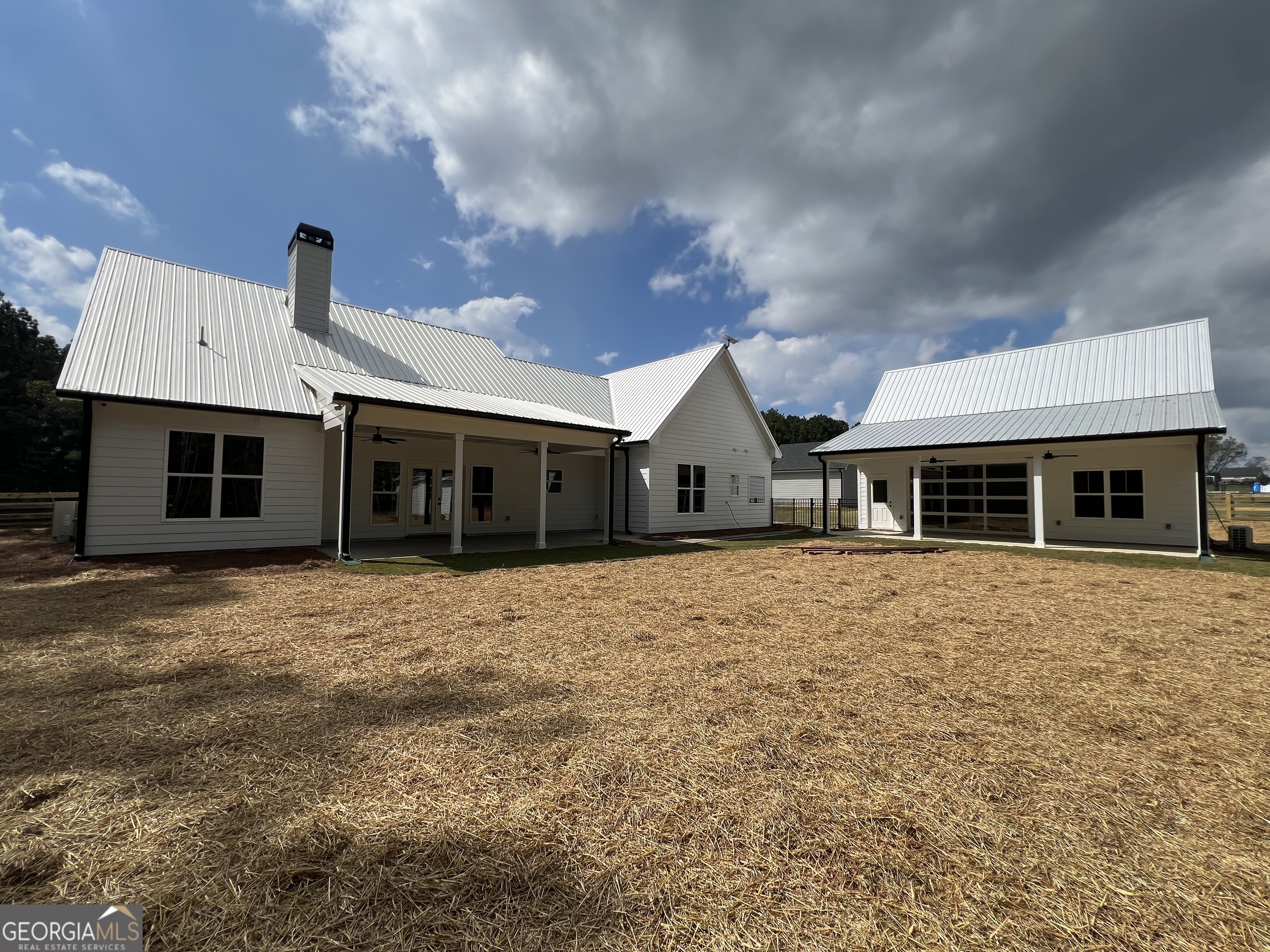3050 Mahlon Smith Road Social Circle, GA 30025 - Photo 6 of 37 a front view of a house with a yard