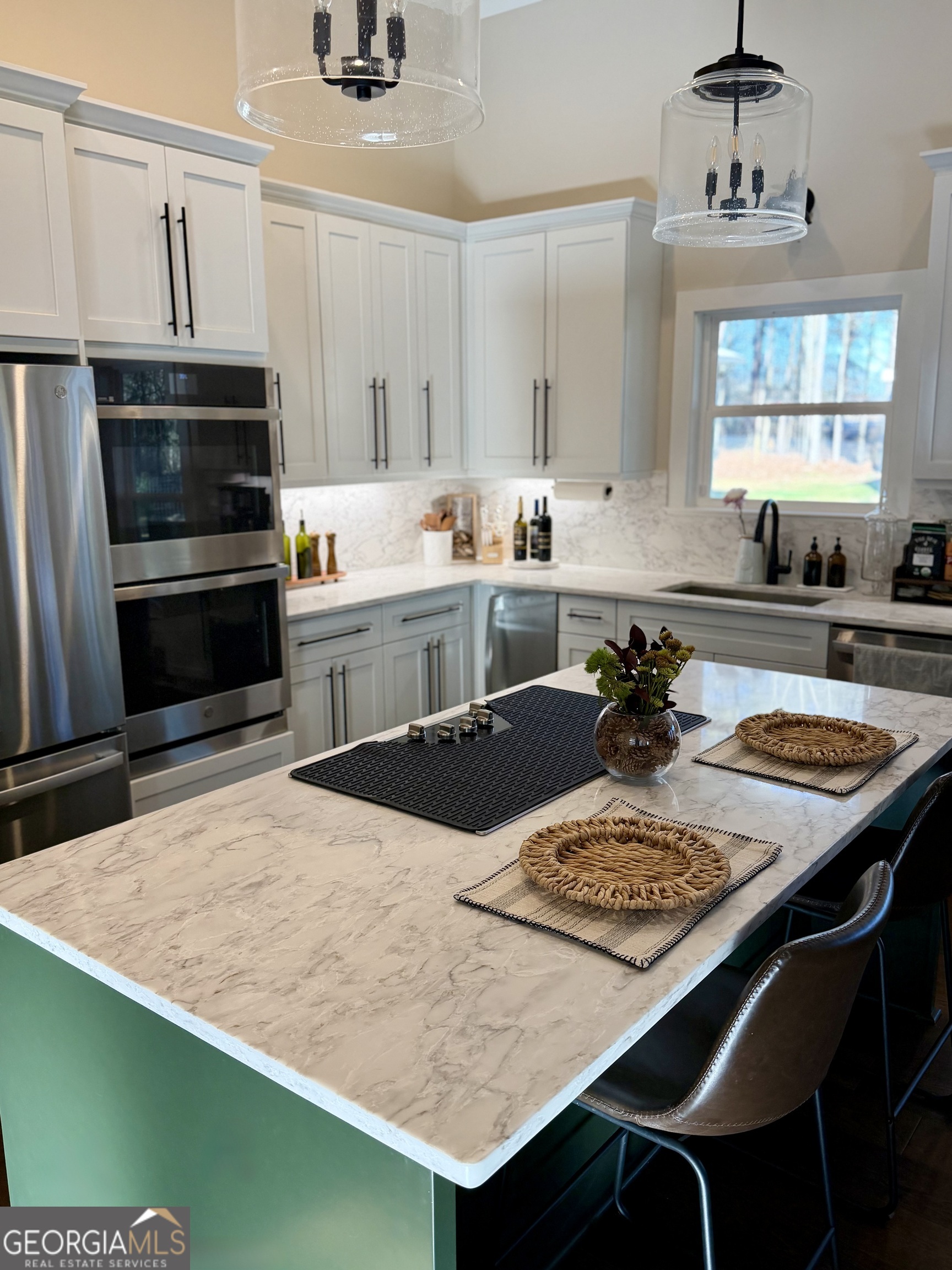 3050 Mahlon Smith Road Social Circle, GA 30025 - Photo 8 of 37 a kitchen with a stove a sink and a refrigerator