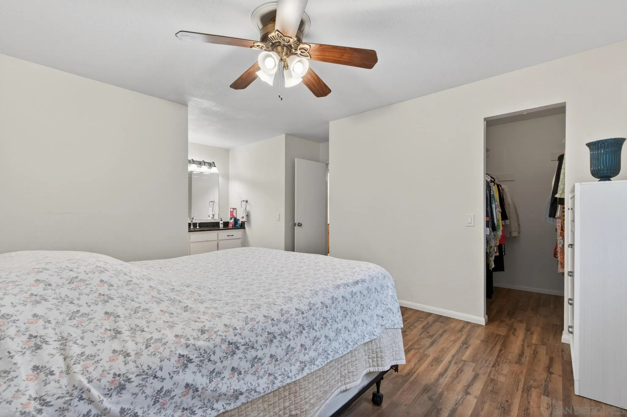 2157 Arnold Way, Unit 201 Alpine, CA 91901 - Photo 16 of 21 a bedroom with a bed and a chandelier