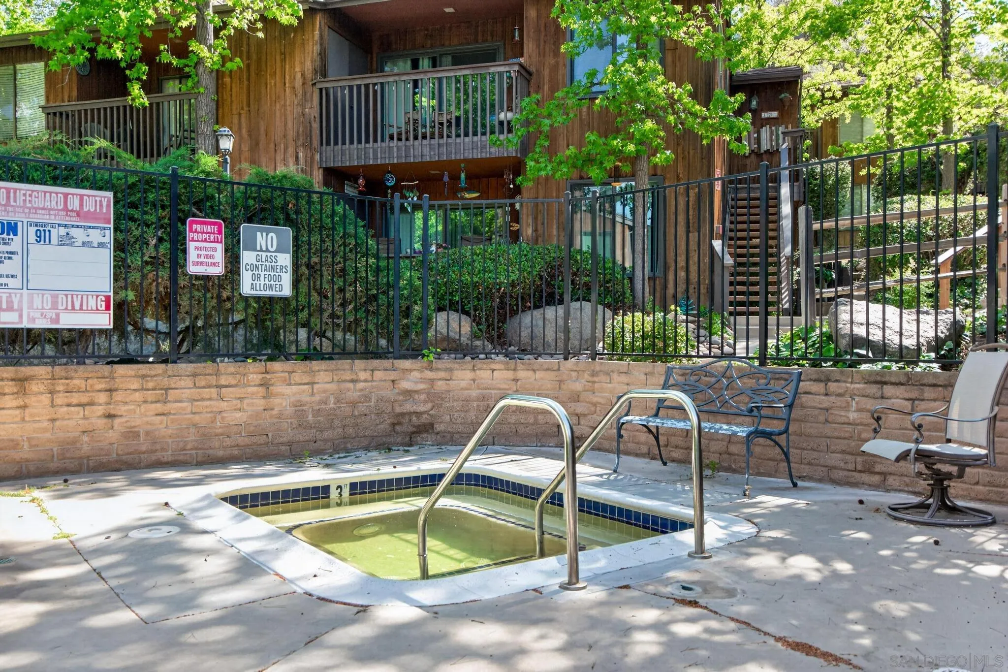 2157 Arnold Way, Unit 201 Alpine, CA 91901 - Photo 18 of 21 a view of a house with a swimming pool