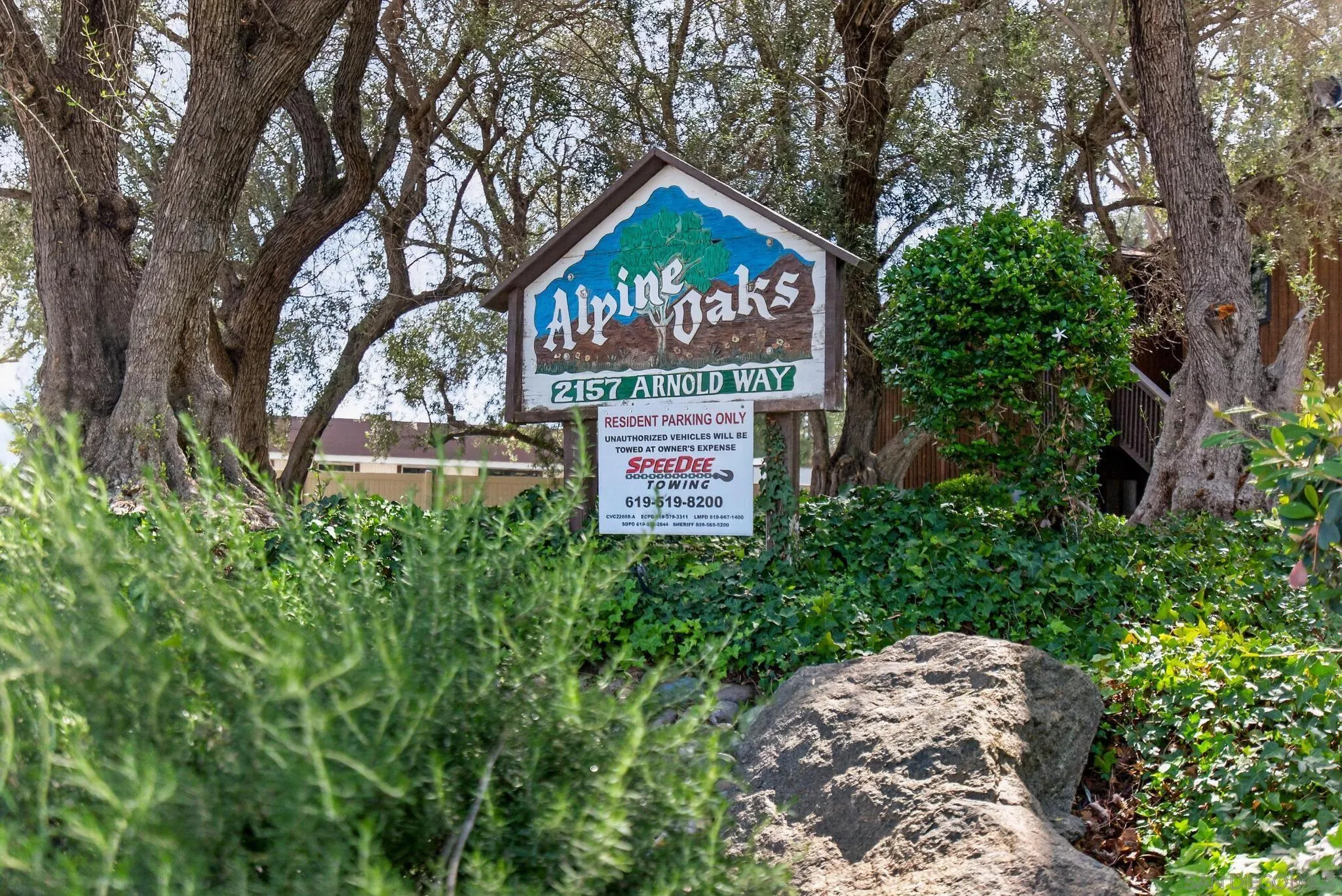 2157 Arnold Way, Unit 201 Alpine, CA 91901 - Photo 21 of 21 a sign that is sitting in front of a tree