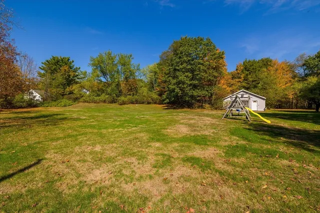 a view of a yard with a house