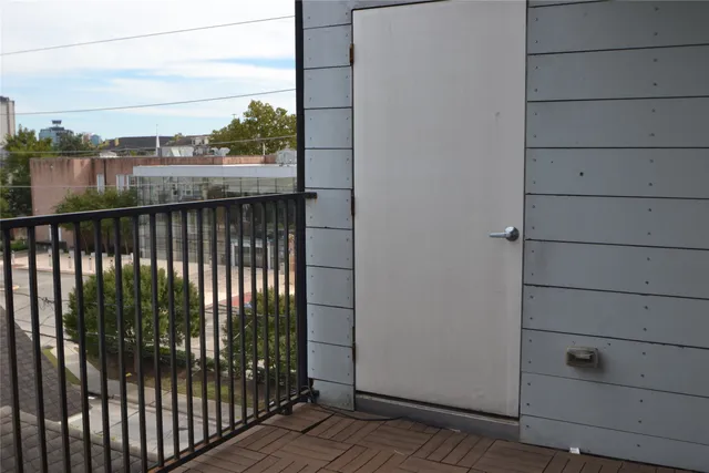 a view of balcony with a floor to ceiling window