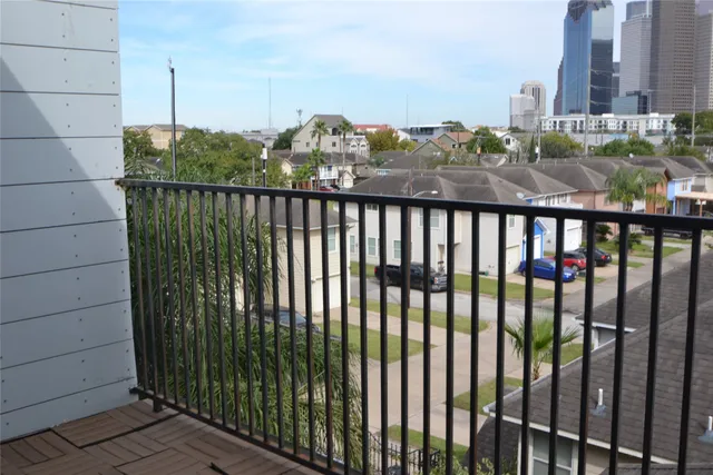 a view of a balcony with city view