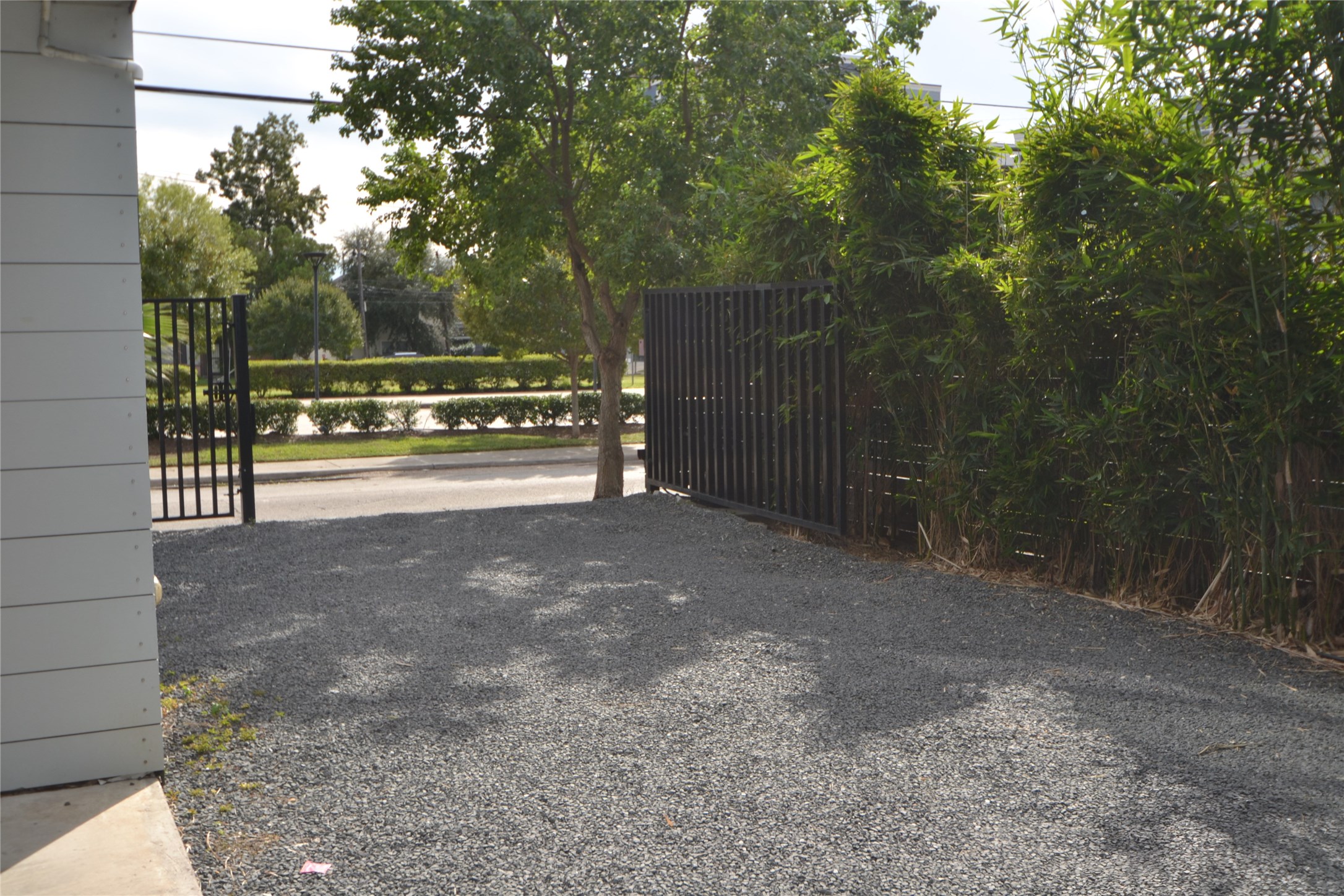 1316 Cleveland Street, Unit C Houston, TX 77019 - Photo 26 of 38 a view of a yard with large trees