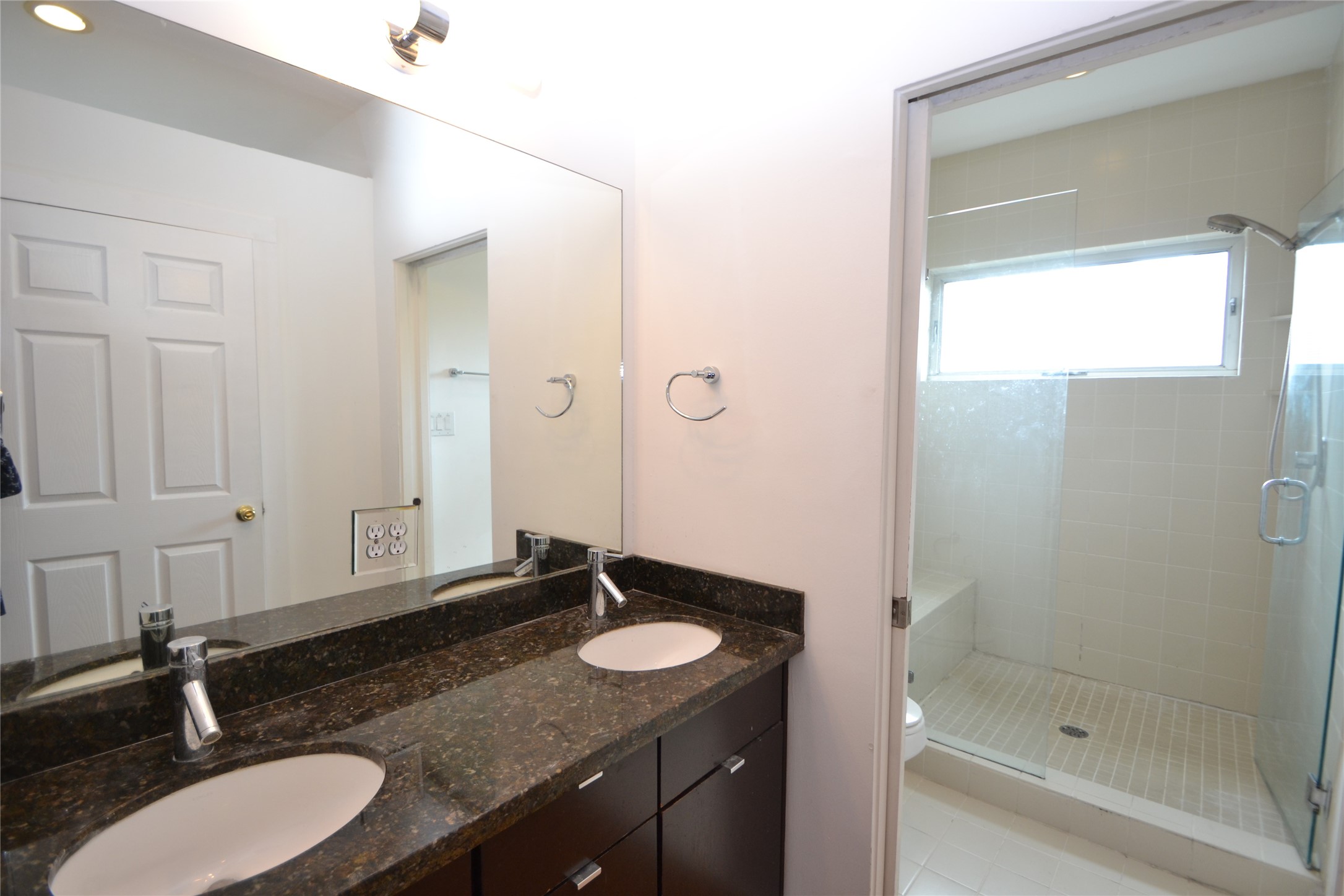 1316 Cleveland Street, Unit C Houston, TX 77019 - Photo 36 of 38 a bathroom with a granite countertop sink and a mirror