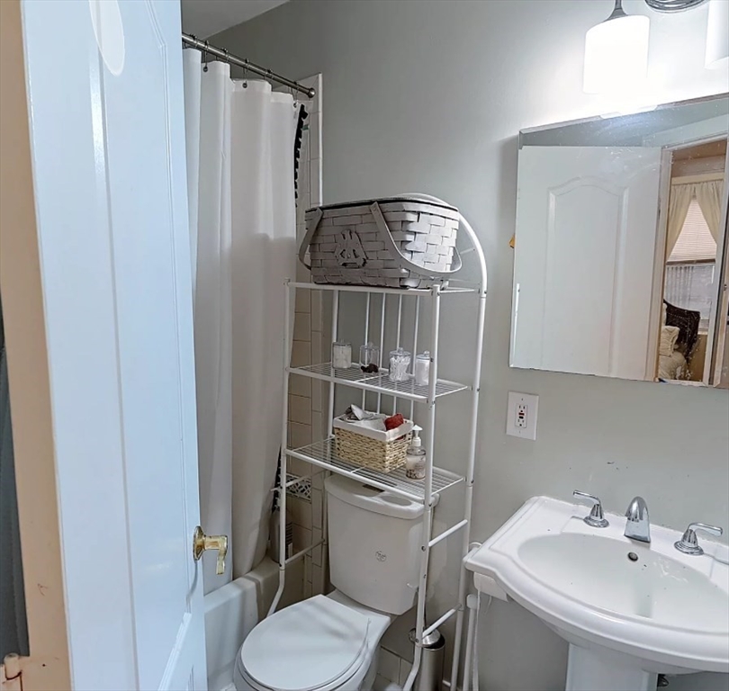 91 Prince Street, Unit 18 Boston, MA 02113 - Photo 7 of 13 a bathroom with a sink toilet and mirror