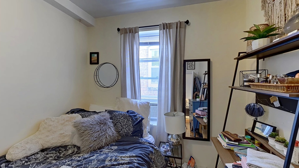 91 Prince Street, Unit 18 Boston, MA 02113 - Photo 8 of 13 a bedroom with a bed and a window