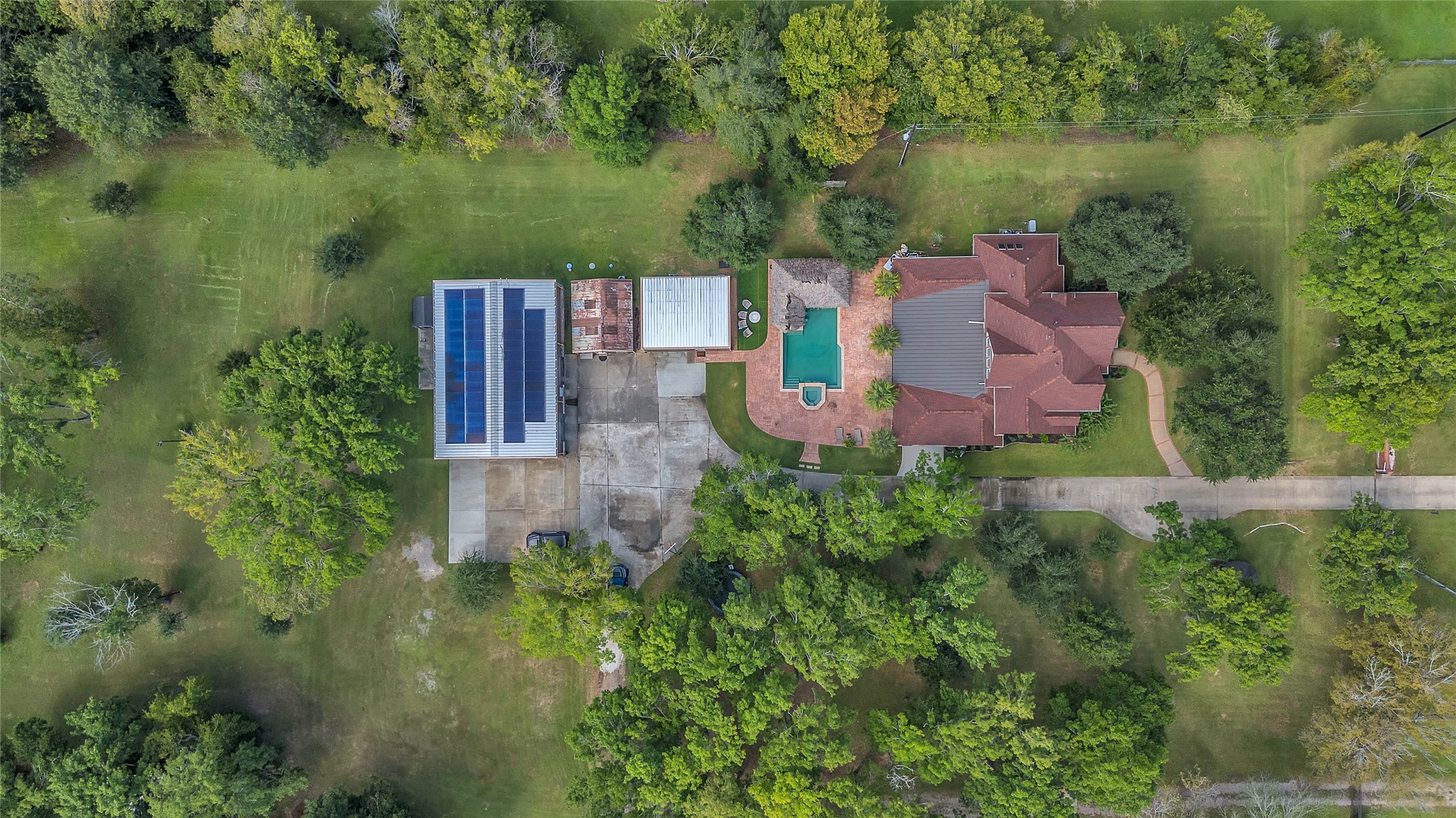 4910 Brookside Road Pearland, TX 77581 - Photo 2 of 20 an aerial view of a house with a yard and lake view
