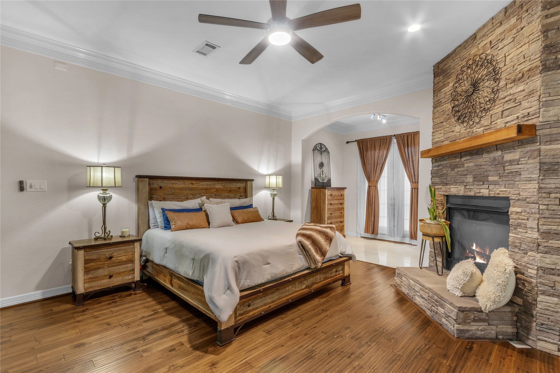 4910 Brookside Road Pearland, TX 77581 - Photo 8 of 20 a bedroom with a bed and a fireplace