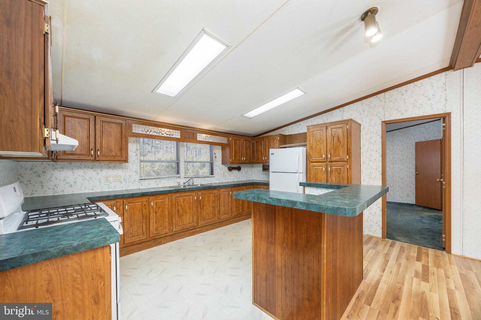 22147 Royal Oak Road Quantico, MD 21856 - Photo 13 of 65 a kitchen with stainless steel appliances granite countertop a sink and cabinets