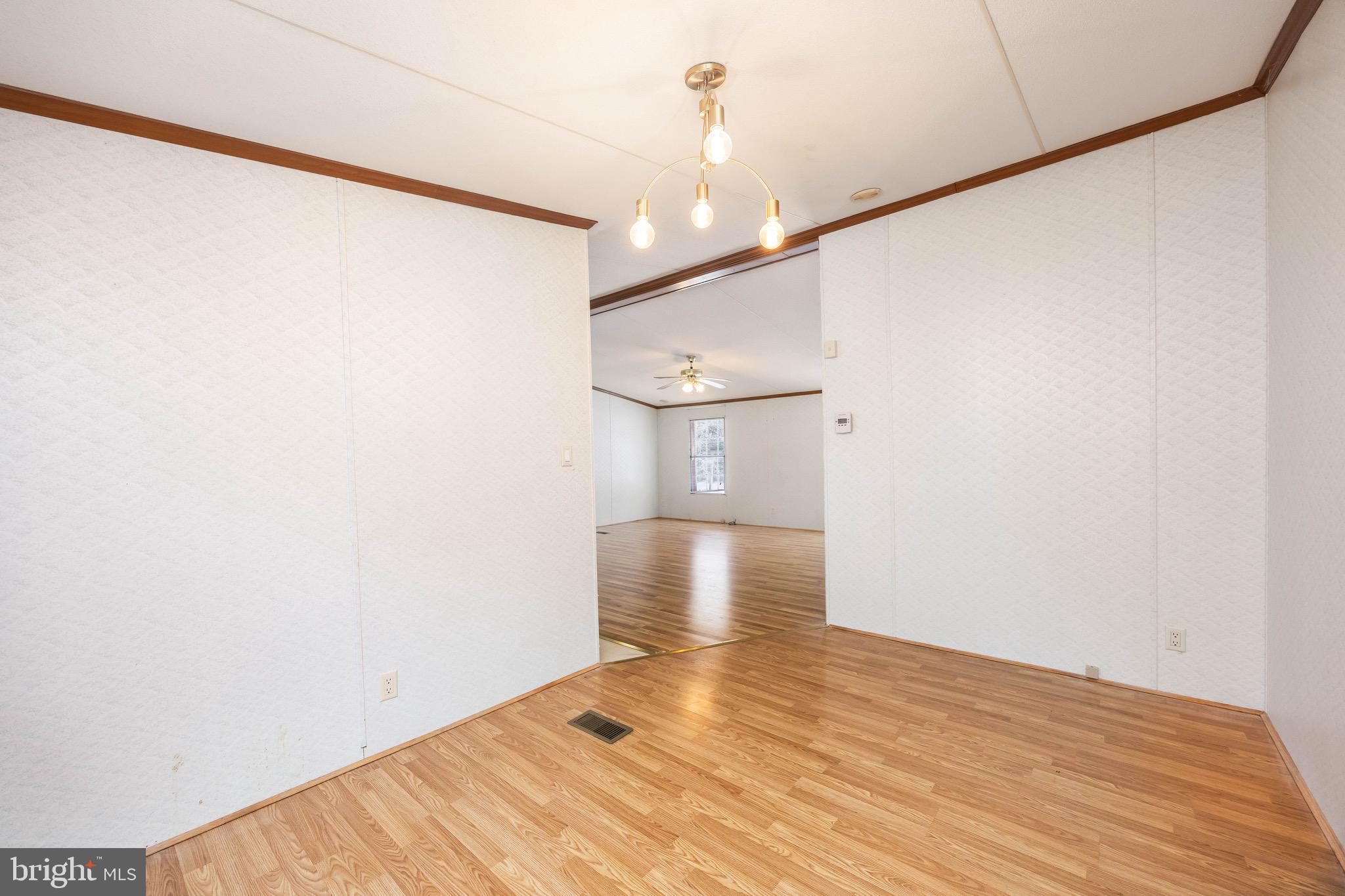 22147 Royal Oak Road Quantico, MD 21856 - Photo 19 of 65 a view of empty room with wooden floor