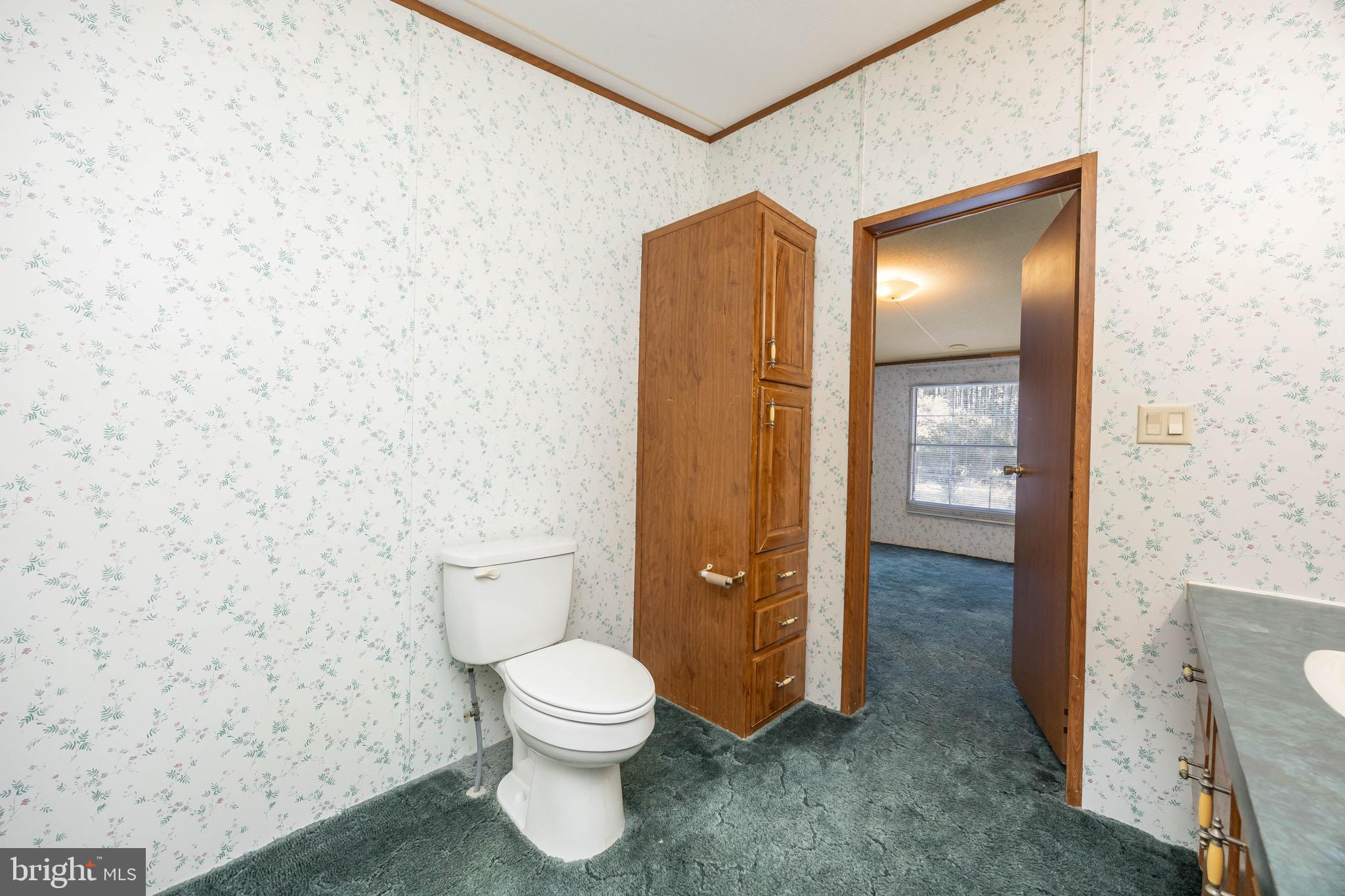 22147 Royal Oak Road Quantico, MD 21856 - Photo 33 of 65 a bathroom with a toilet and a sink