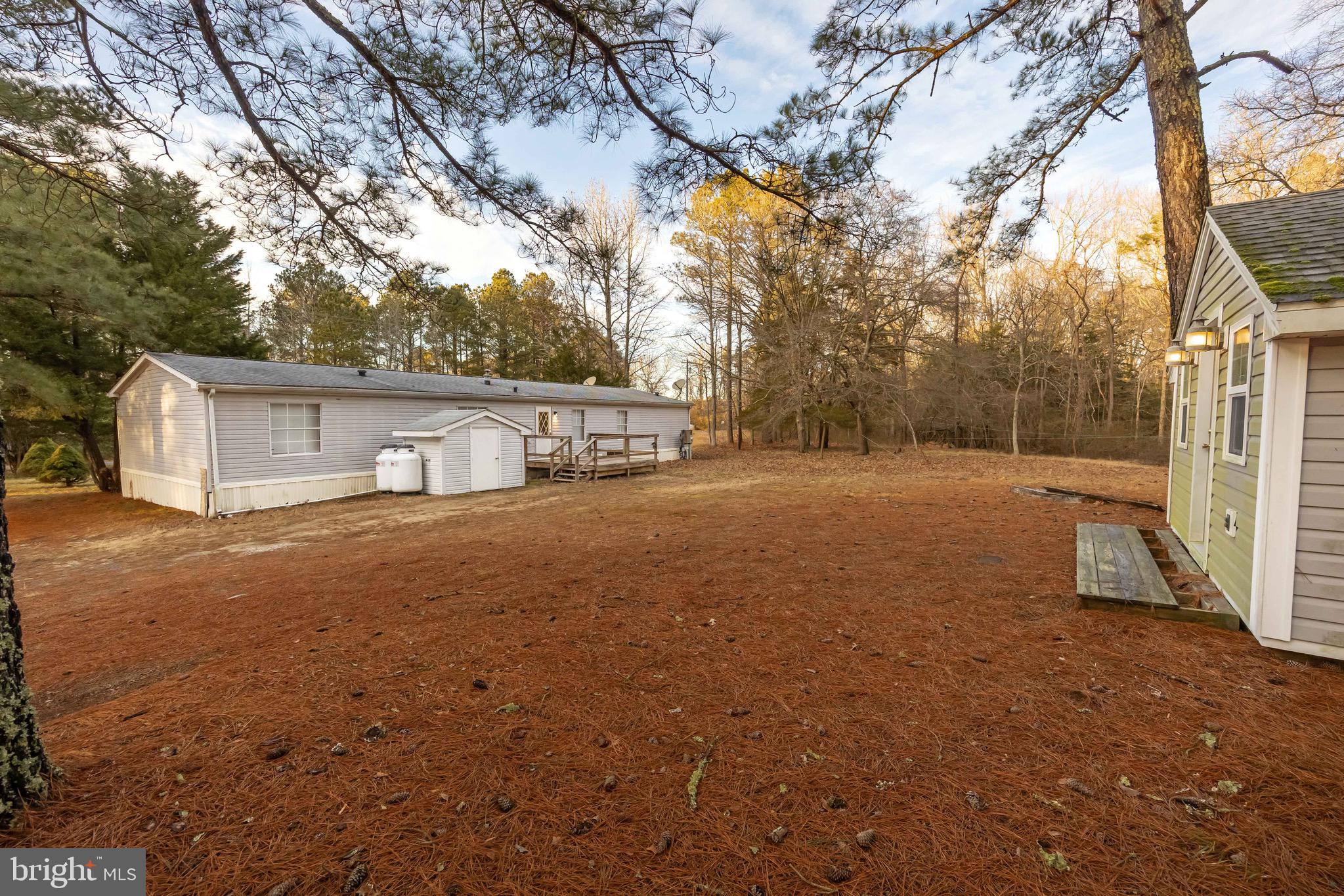 22147 Royal Oak Road Quantico, MD 21856 - Photo 64 of 65 a front view of house with yard and trees