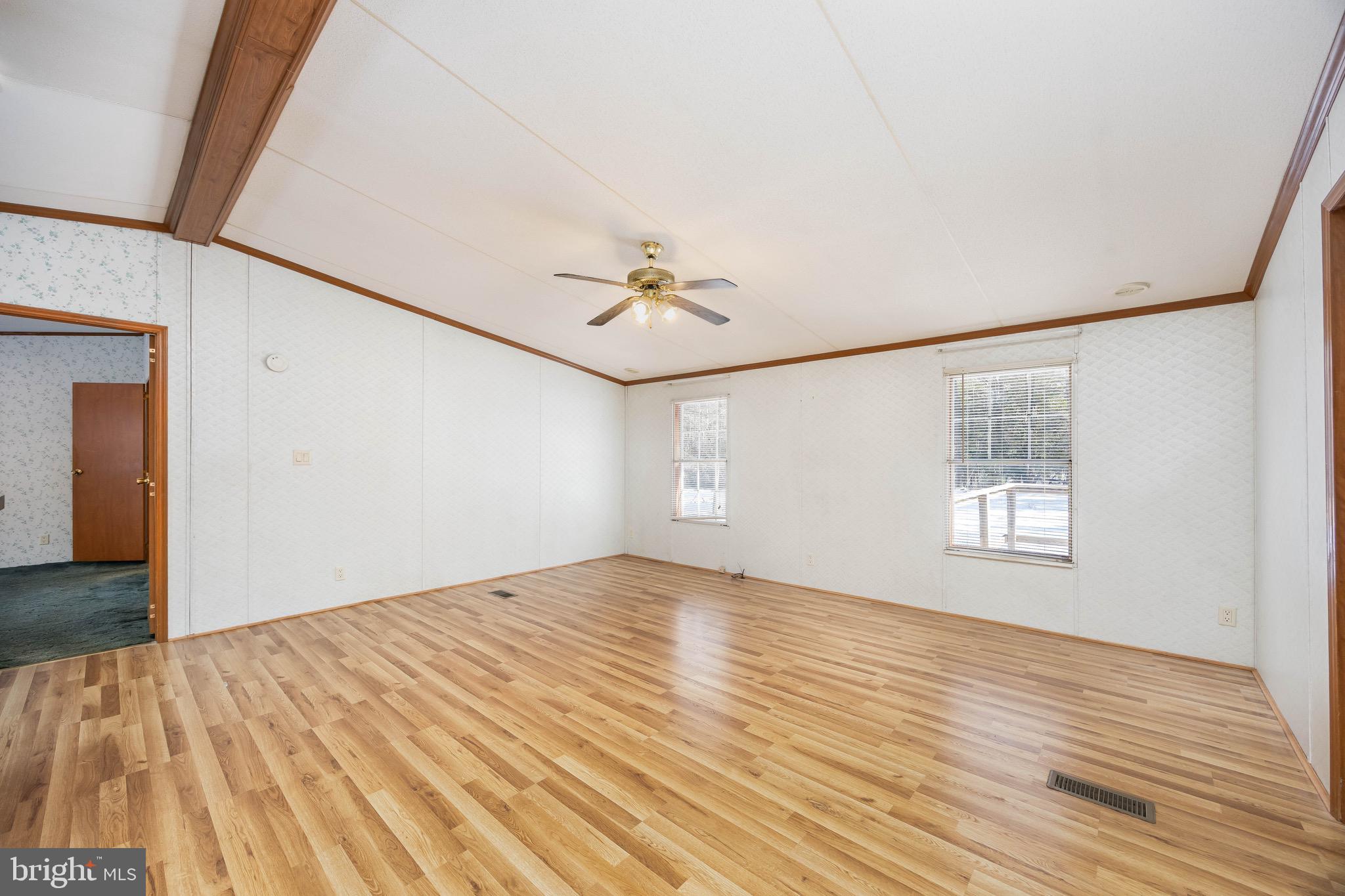 22147 Royal Oak Road Quantico, MD 21856 - Photo 10 of 65 a view of a big room with wooden floor and windows