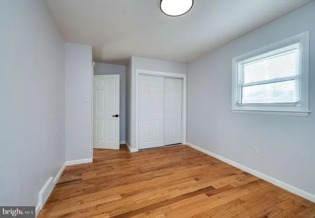 a view of an empty room with stairs