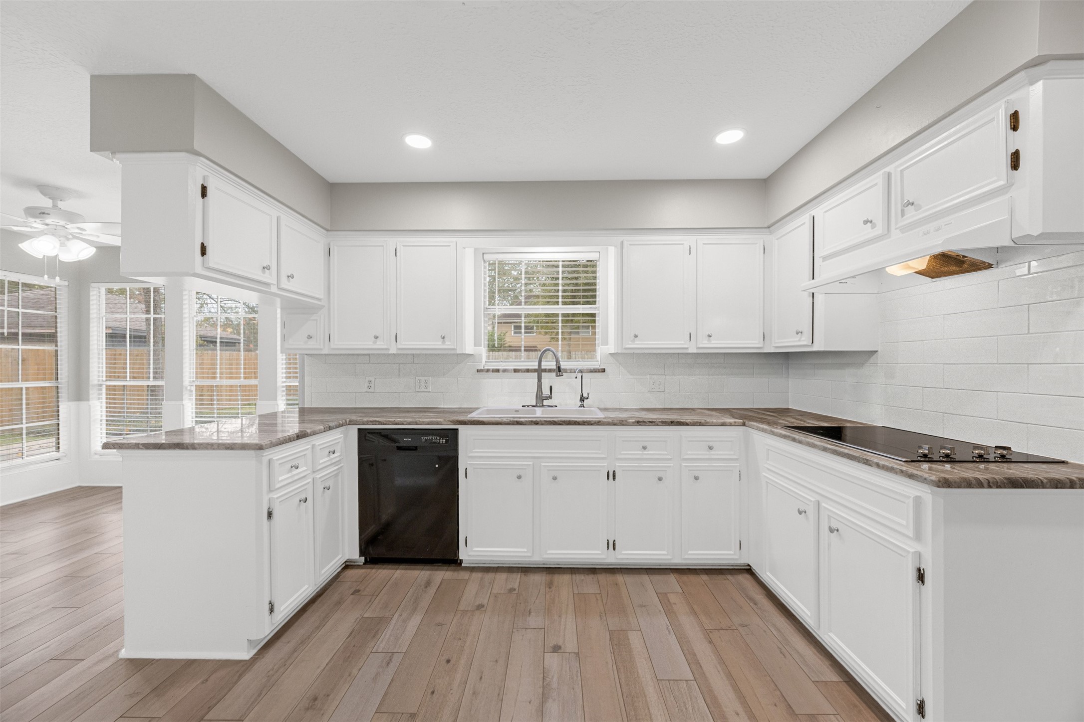 3607 Alderwood Drive Spring, TX 77388 - Photo 15 of 33 UPDATED KITCHEN HAS AMPLE CABINETS. NEW LIGHTS, FIXTURES AND QUARTZ COUNTER TOP.