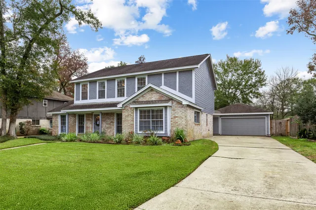front view of a house with a garden