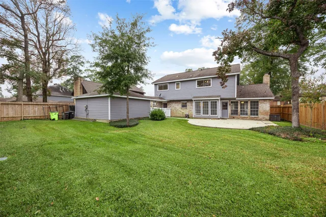 wooden floor fireplace and windows in an empty room