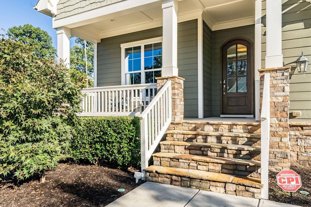 8035 Brandyapple Drive Raleigh, NC 27615 - Photo 2 of 30 Front Porch with stone steps, columns, arched solid mahogany front door with bevel glass. Front Porch