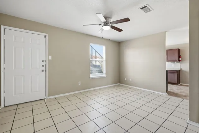 a view of an empty room and window