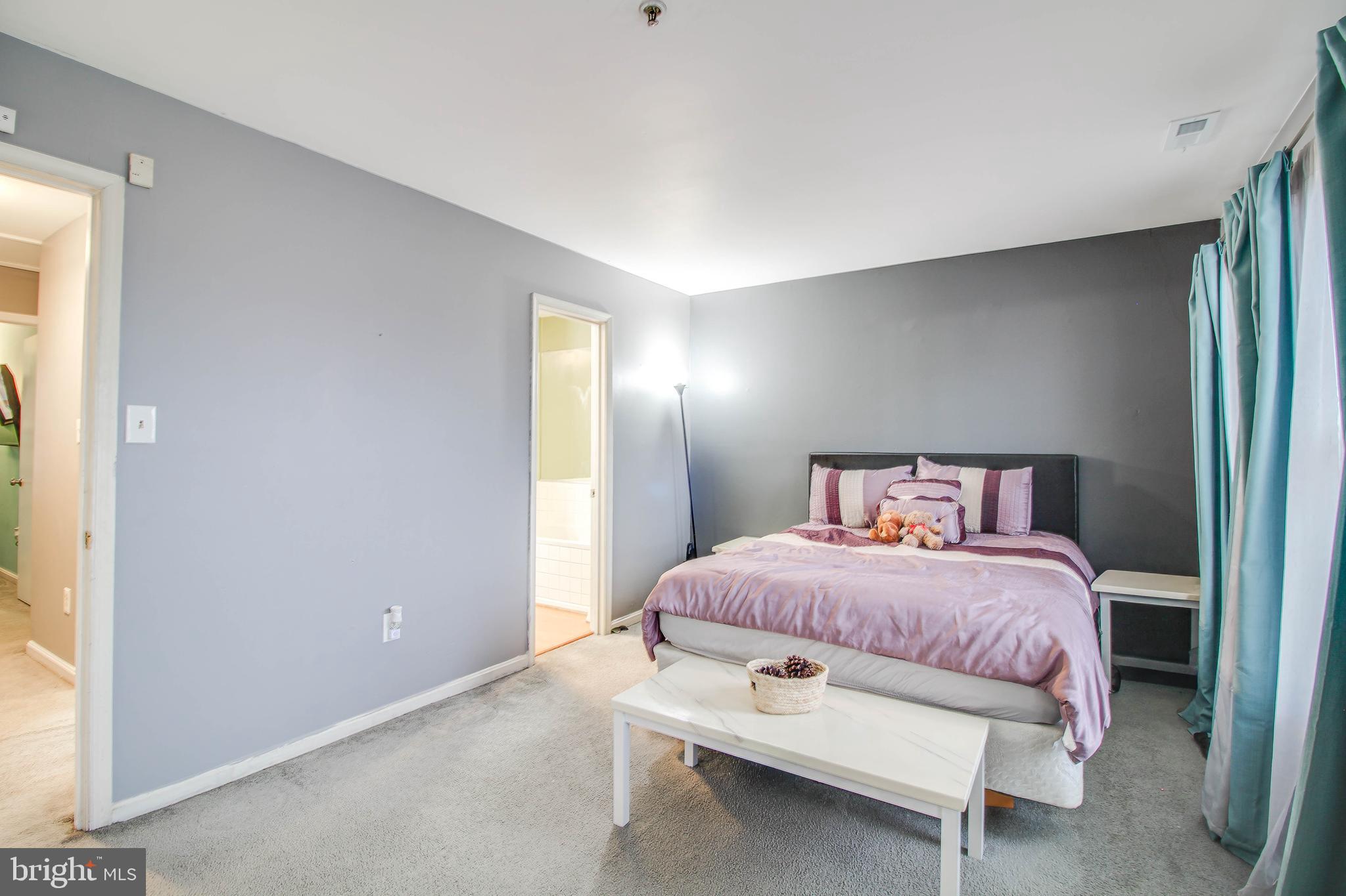 1408 Olmstead Street Curtis Bay, MD 21226 - Photo 14 of 40 a bedroom with a bed and a window