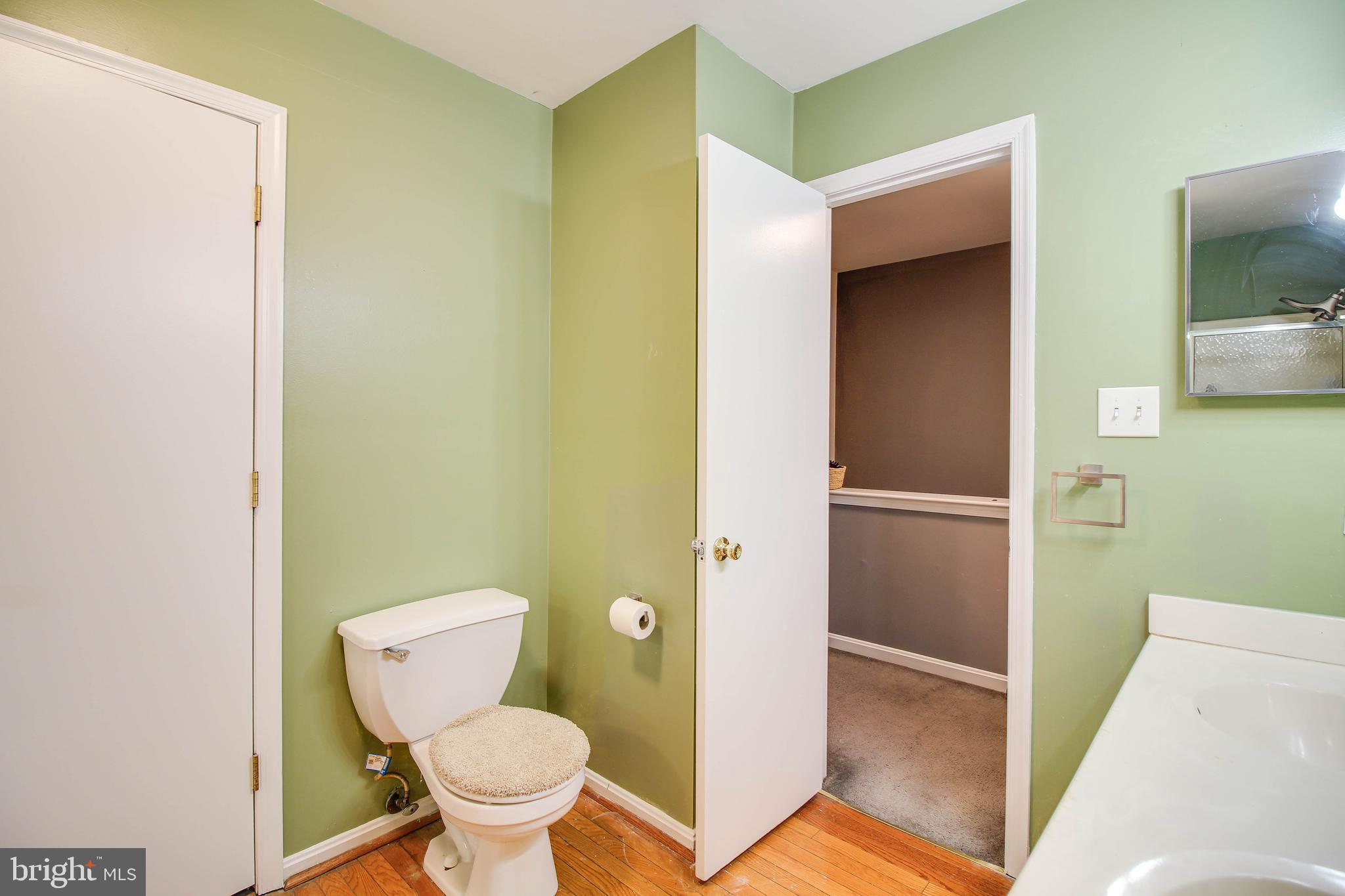 1408 Olmstead Street Curtis Bay, MD 21226 - Photo 16 of 40 a bathroom with a toilet and a sink